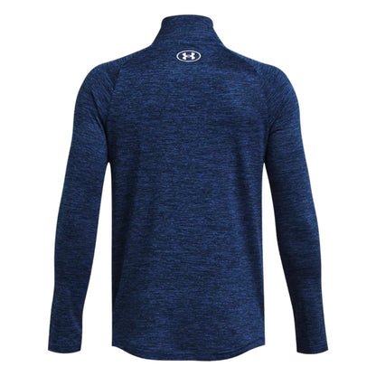 A dark blue athletic long-sleeve shirt with a high collar is displayed from the back showcasing a textured fabric and a logo at the neck area.