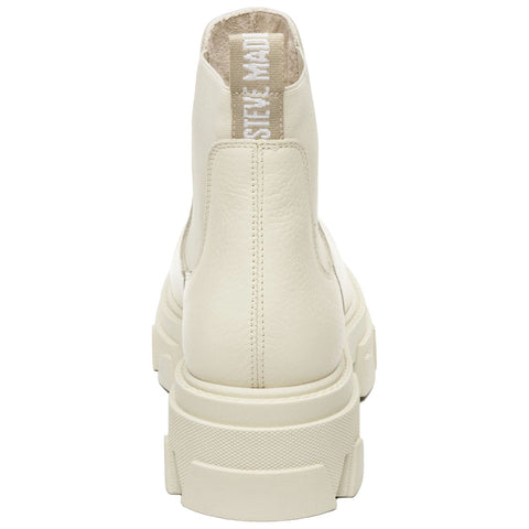 A pair of creamy white chunky ankle boots stands upright showcasing their textured surface and thick sole with a looped tag on the back suggesting a stylish and modern design.