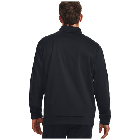 A person wearing a black long-sleeve sweatshirt faces away with hands relaxed at sides in a simple, neutral background emphasizing the clothing's design and color.