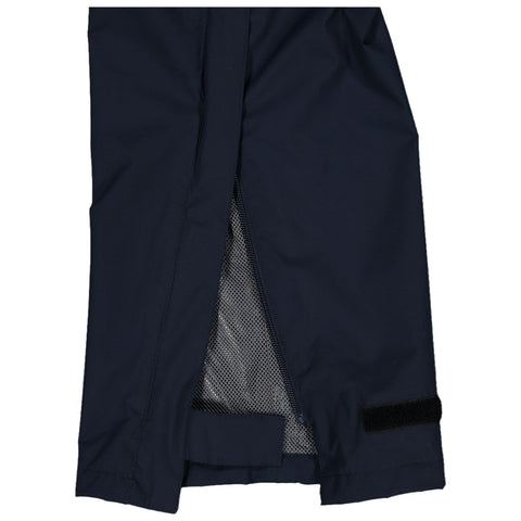 A pair of dark fabric pants is displayed partially open showing a mesh lining inside the unzipped section near the ankle with a hook and loop adjustment strap at the bottom.