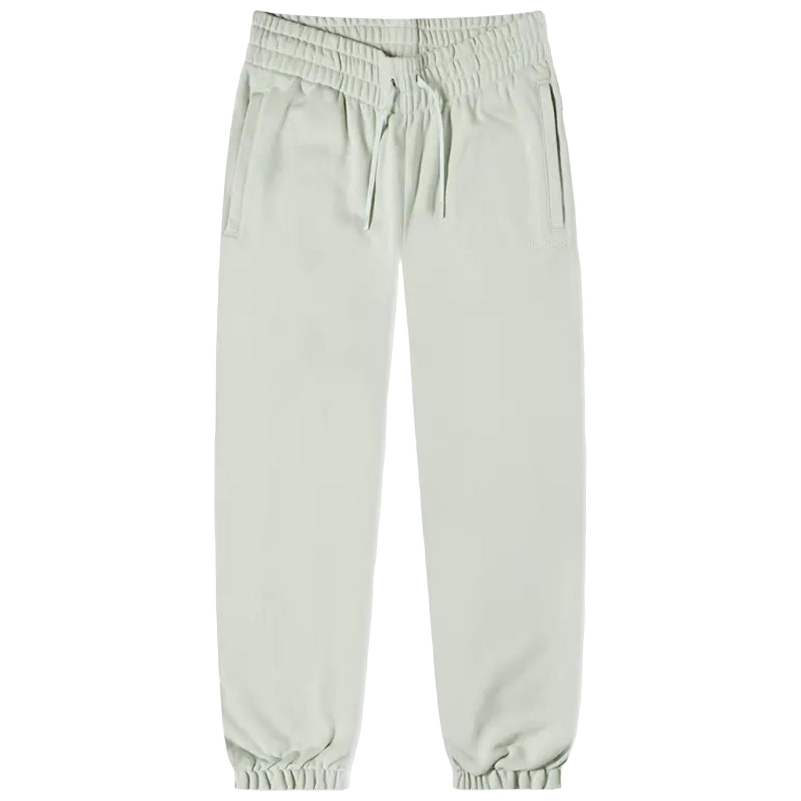 Light green jogger pants are displayed standing upright with an elastic waistband and drawstring detailing featuring two side pockets suitable for casual or athletic wear.