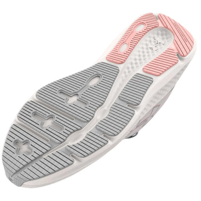 A sneaker sole features a detailed tread design with both gray and pink rubber elements showcasing grooves and patterns intended for traction on various surfaces in an athletic context.