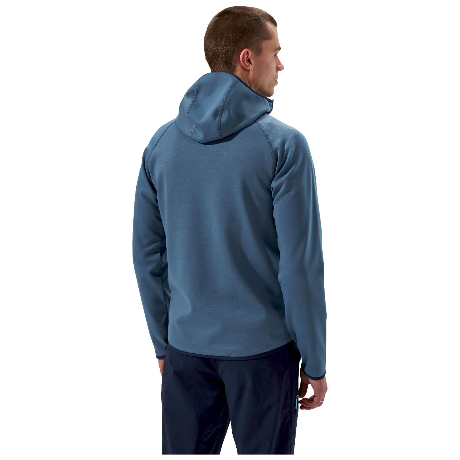 A man is standing with his back turned, wearing a blue hoodie. He has short hair and is positioned against a plain background, suggesting a casual or outdoor setting.