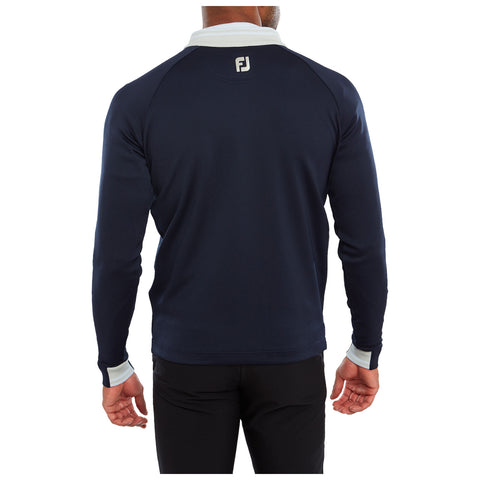 A person is wearing a navy blue long-sleeve shirt with a white collar and cuffs facing away from the viewer in a neutral setting