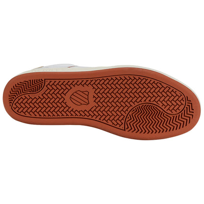 A shoe's rubber sole is displayed showing a pattern of grooves and lines designed for traction the sole is primarily brown with lighter sections contrasting its texture and design