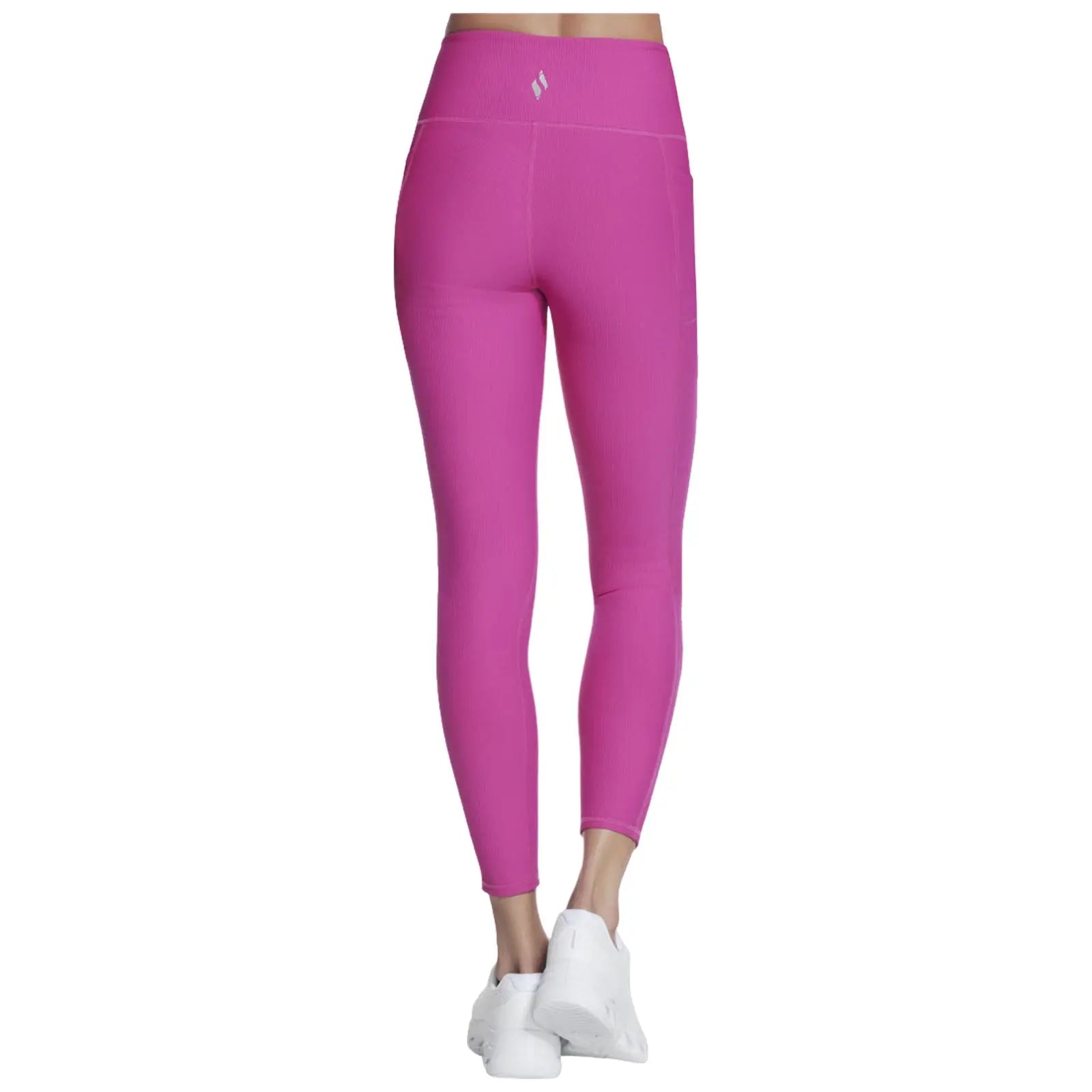 Fitted pink leggings are displayed standing upright against a plain background showcasing a simple athletic style ideal for workouts or casual wear with white sneakers completing the look.