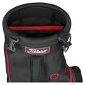 A black golf bag with a round top and a red interior features the Titleist logo and a buckle for securing the top. The bag displays various storage compartments and straps.