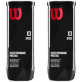 Two cylindrical black containers stand side by side filled with padel balls. The labels display the brand logo in red and text highlighting features like speed performance and suitability for slower court surfaces.