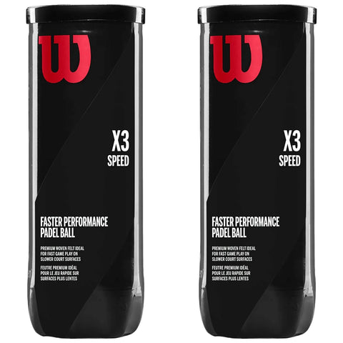 Two cylindrical black containers stand side by side filled with padel balls. The labels display the brand logo in red and text highlighting features like speed performance and suitability for slower court surfaces.