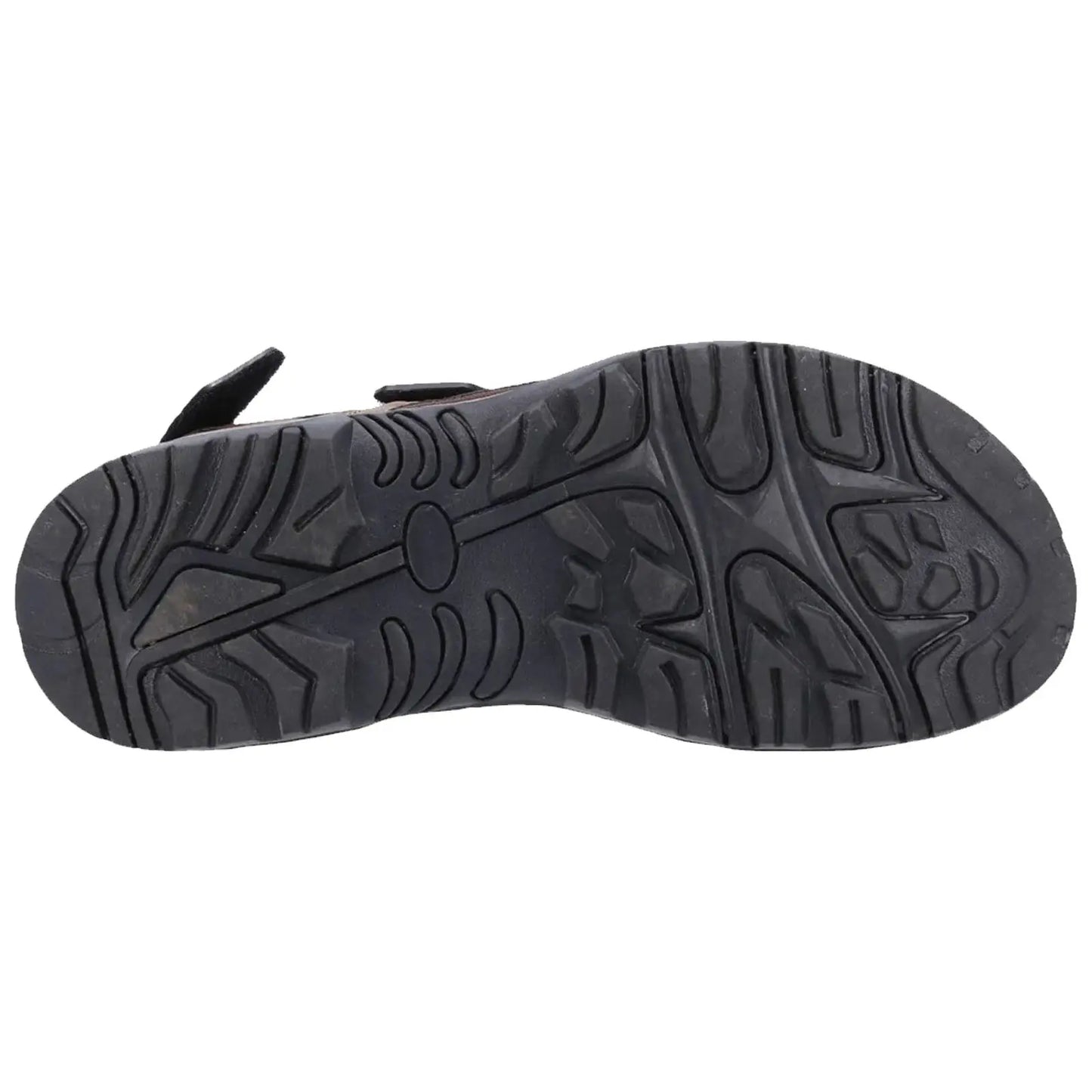 A shoe sole is displayed resting on a flat surface showcasing its textured tread designed for grip and support highlighting various patterns for traction during walking or outdoor activities.