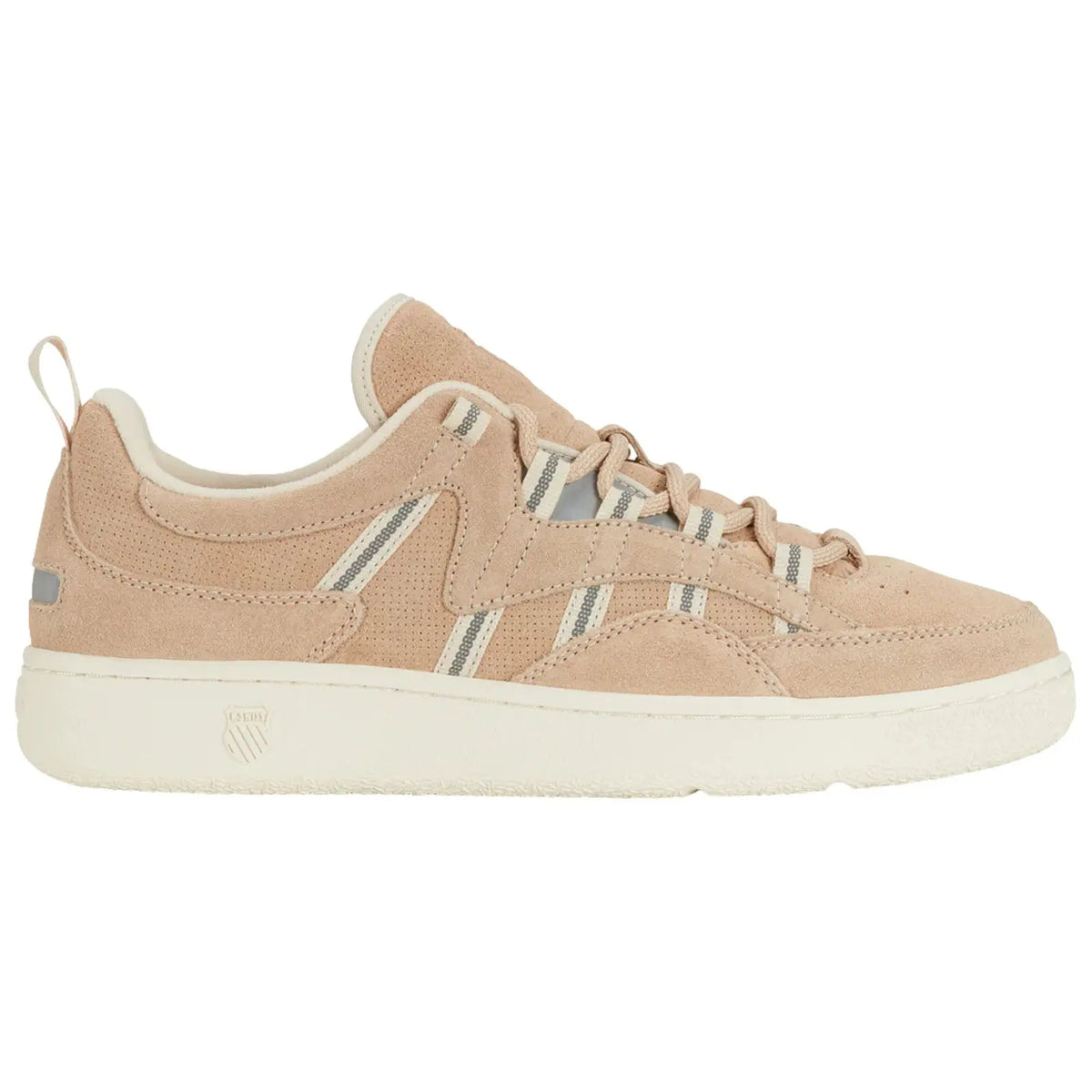 A tan sneaker made of suede with white and gray accents sits side profile on a plain background showcasing a streamlined design with laces and a cushioned sole
