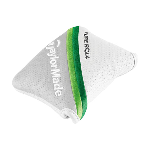 A triangular putting aid is positioned upright featuring a white textured surface with a green stripe and the words TaylorMade and Pure Roll embossed on it.