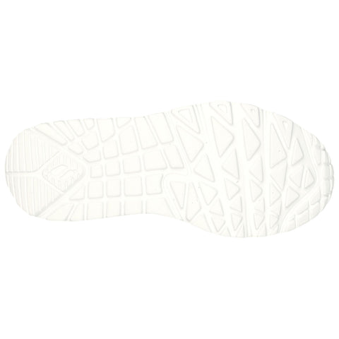 A white shoe sole with a textured tread pattern rests flat against a plain background showcasing its intricate designs and grooves for traction during movement.