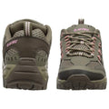 A pair of green hiking shoes is positioned with one shoe facing forward and the other backward showcasing the design details including mesh and pink laces in a neutral background.