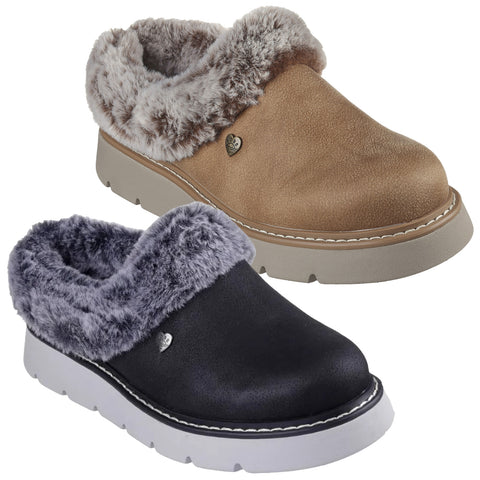 Two pairs of cozy slip-on shoes are displayed side by side one pair is light brown with a furry collar and the other pair is black with a grey furry collar both have a white sole.