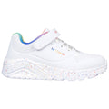 White athletic shoe with a speckled sole features a velcro strap and laces showcasing colorful elements on the heel in a simple and modern design suitable for casual wear.
