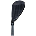 A golf club head is positioned upright showcasing a sleek black surface with textured grooves the club is ready for a swing on a golf course or range.