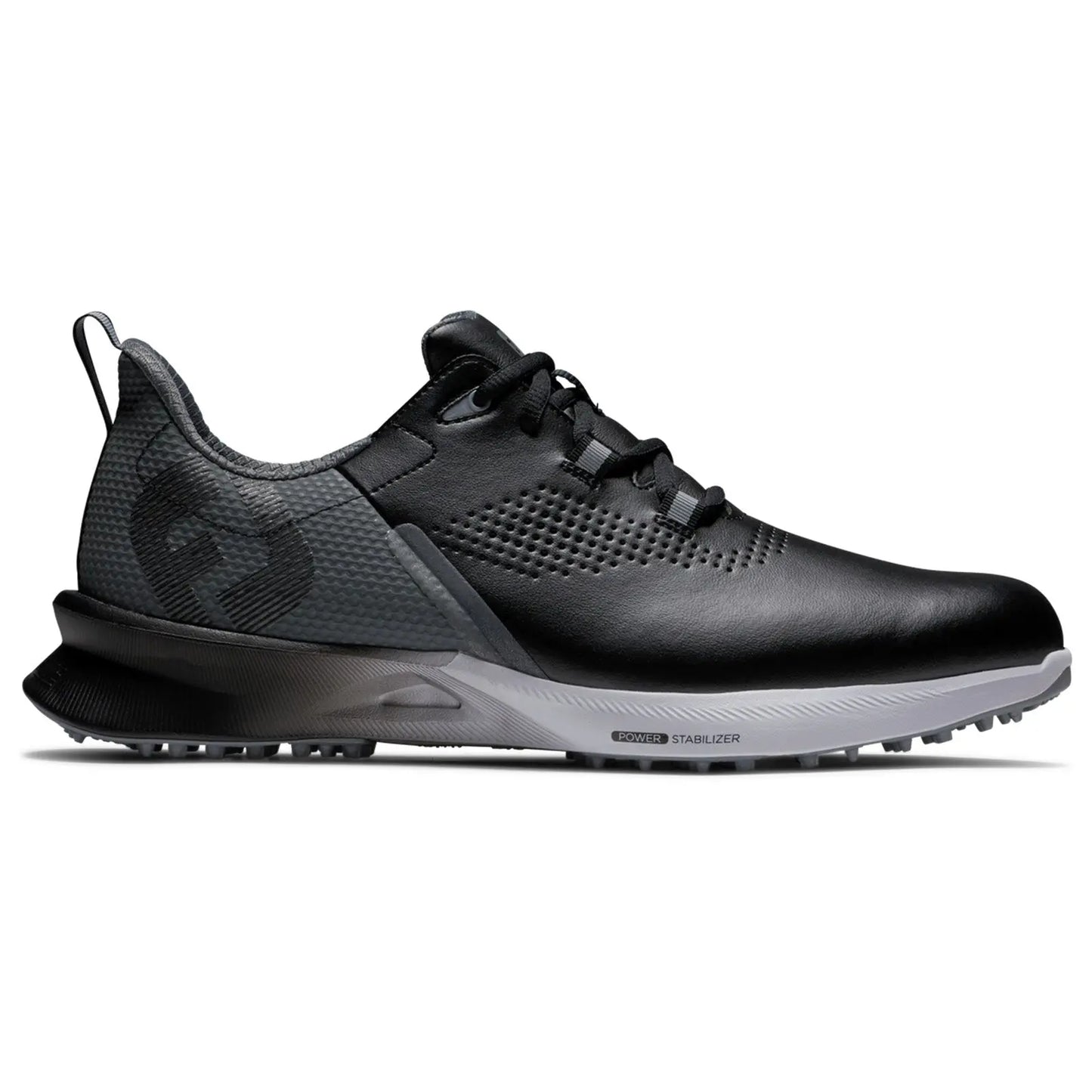 A black athletic shoe with a textured surface and a gray outsole sits on a flat surface showcasing its sleek design and lacing system meant for comfort and performance.