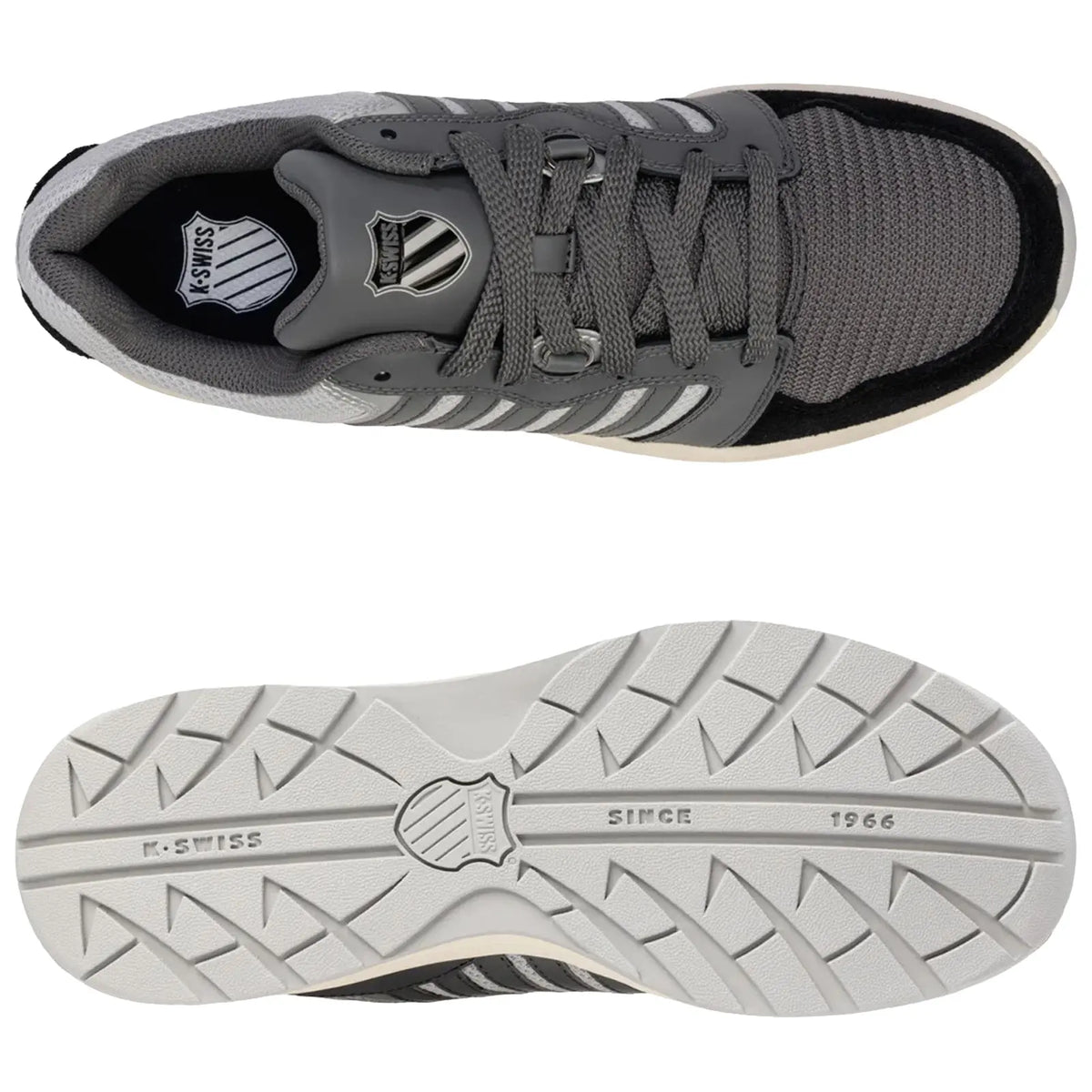 A grey athletic shoe with a textured mesh upper is positioned above its white rubber sole featuring a patterned tread displaying the brand name K-Swiss and the year 1966.