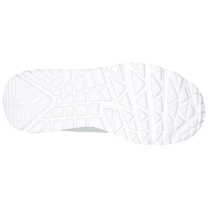 A white shoe sole features a patterned grip with geometric shapes designed for traction. It is isolated against a plain background emphasizing the shoe's design and functionality.