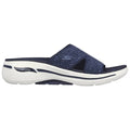 A navy blue sandal with a woven upper features an open toe design and a thick white sole labeled Arch Fit providing comfort and support in casual settings.