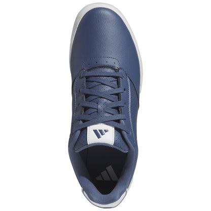 A blue athletic shoe with a smooth leather surface and perforated accents sits upright displaying its lace-up design and white outer sole against a plain white background.