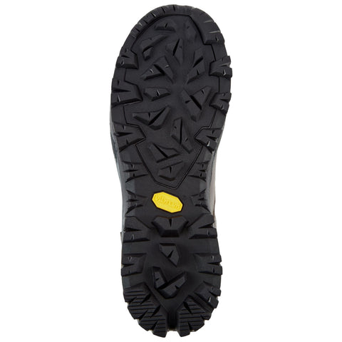 A black rubber shoe sole is depicted featuring a rugged tread pattern designed for traction on various surfaces its context suggests outdoor use or rugged terrain.