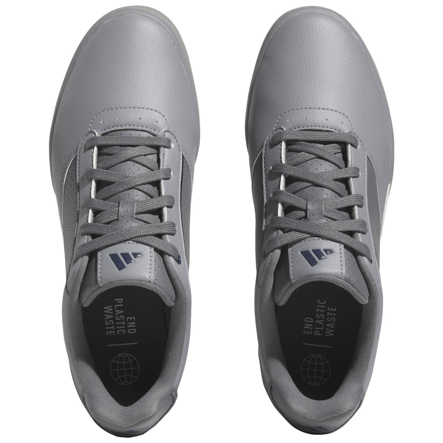 Gray athletic shoes are displayed from a top view with laces tightly secured featuring a sleek design and a message inside the shoe that reads END PLASTIC WASTE