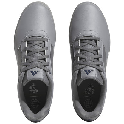 Gray athletic shoes are displayed from a top view with laces tightly secured featuring a sleek design and a message inside the shoe that reads END PLASTIC WASTE