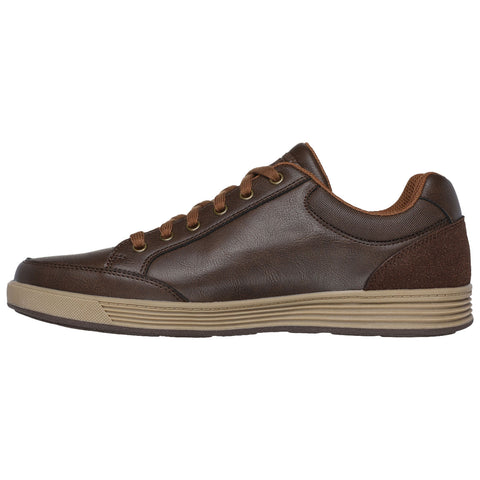 A brown leather sneaker rests flat with brown laces and a textured rubber sole the sneaker's design is casual and stylish suitable for various informal settings