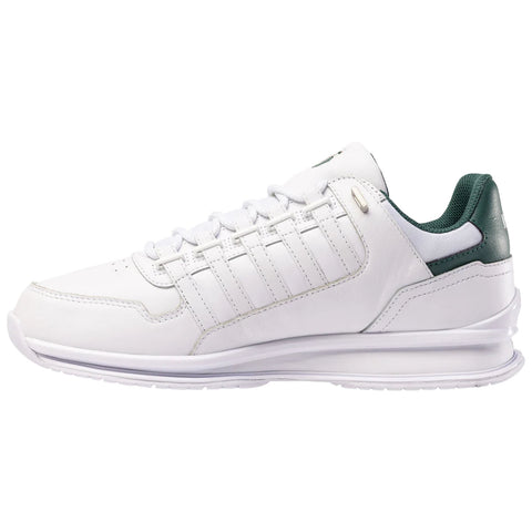 A white athletic shoe with green accents rests on a flat surface showcasing a sleek design featuring mesh and leather material with lace-up closure and a cushioned sole.