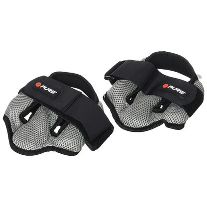 A pair of fitness gloves lies flat featuring a black and gray design with mesh material and straps for secure fitting, typically used for grip and protection during workouts.