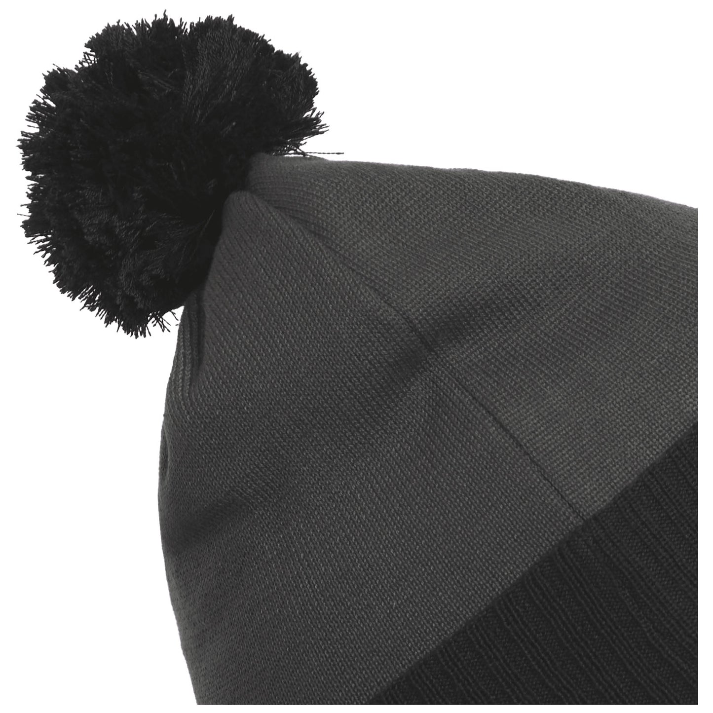 A black knitted beanie with a pom-pom on top is positioned at an angle, showcasing its textured fabric and snug fit, suitable for cold weather wear.