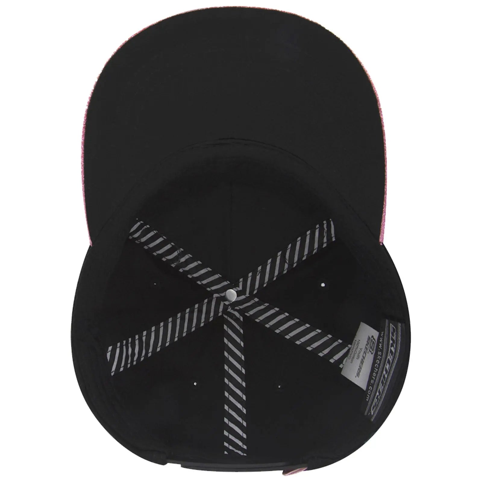 A black baseball cap with a pink brim lies on a flat surface showcasing its interior structure including black fabric and striped stitching lines with a circular button at the top.