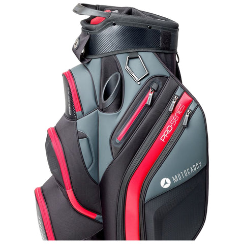 A golf bag stands upright featuring a sleek design in gray and black with red accents. It includes several zipped pockets and a carrying strap, set against a plain white background.