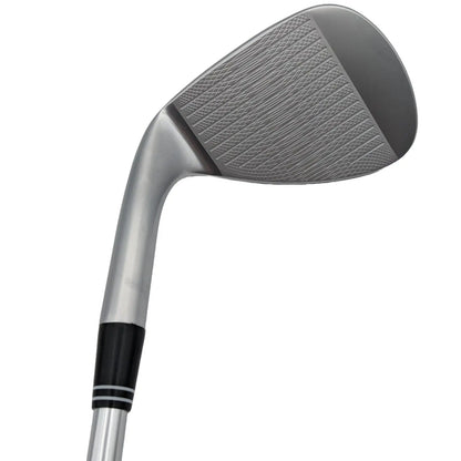 A golf club head is angled upwards showing its shiny metallic surface with grooves for grip the context suggests it is ready for a swing on a golf course.
