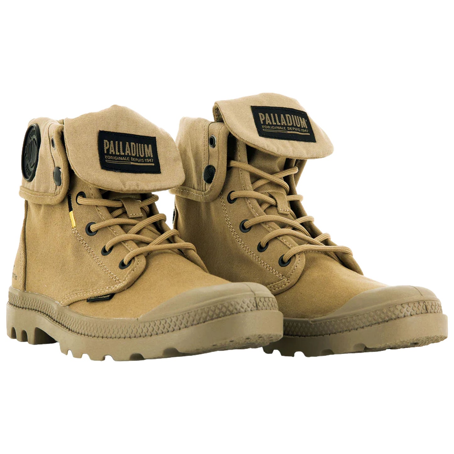 A pair of tan ankle boots featuring laces and a fold-over flap at the top are positioned side by side against a plain background showcasing a rugged sole suitable for outdoor use.