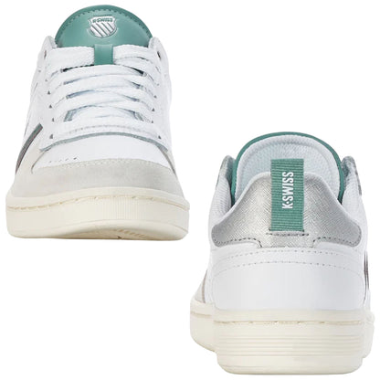 A pair of white sneakers with gray and teal accents sits upright showcasing laces and clean design in a neutral background emphasizing their stylish and sporty appearance.