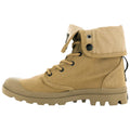 A tan boot with a folded-over upper features laces and eyelets for secure fastening. The sole has deep treads for traction, suitable for outdoor activities or rugged terrain.
