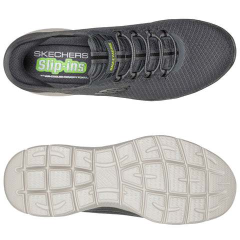 A gray Skechers slip-on shoe is displayed from top and bottom views showcasing its textured upper design and white rubber sole with grip patterns highlighting its casual and comfortable style.