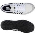 Sneakers are presented from a top view showcasing a white mesh and leather design with black accents. They are placed against a neutral background, highlighting their sporty and casual style.