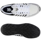 Sneakers are presented from a top view showcasing a white mesh and leather design with black accents. They are placed against a neutral background, highlighting their sporty and casual style.