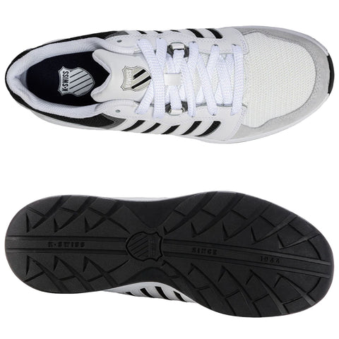 Sneakers are presented from a top view showcasing a white mesh and leather design with black accents. They are placed against a neutral background, highlighting their sporty and casual style.