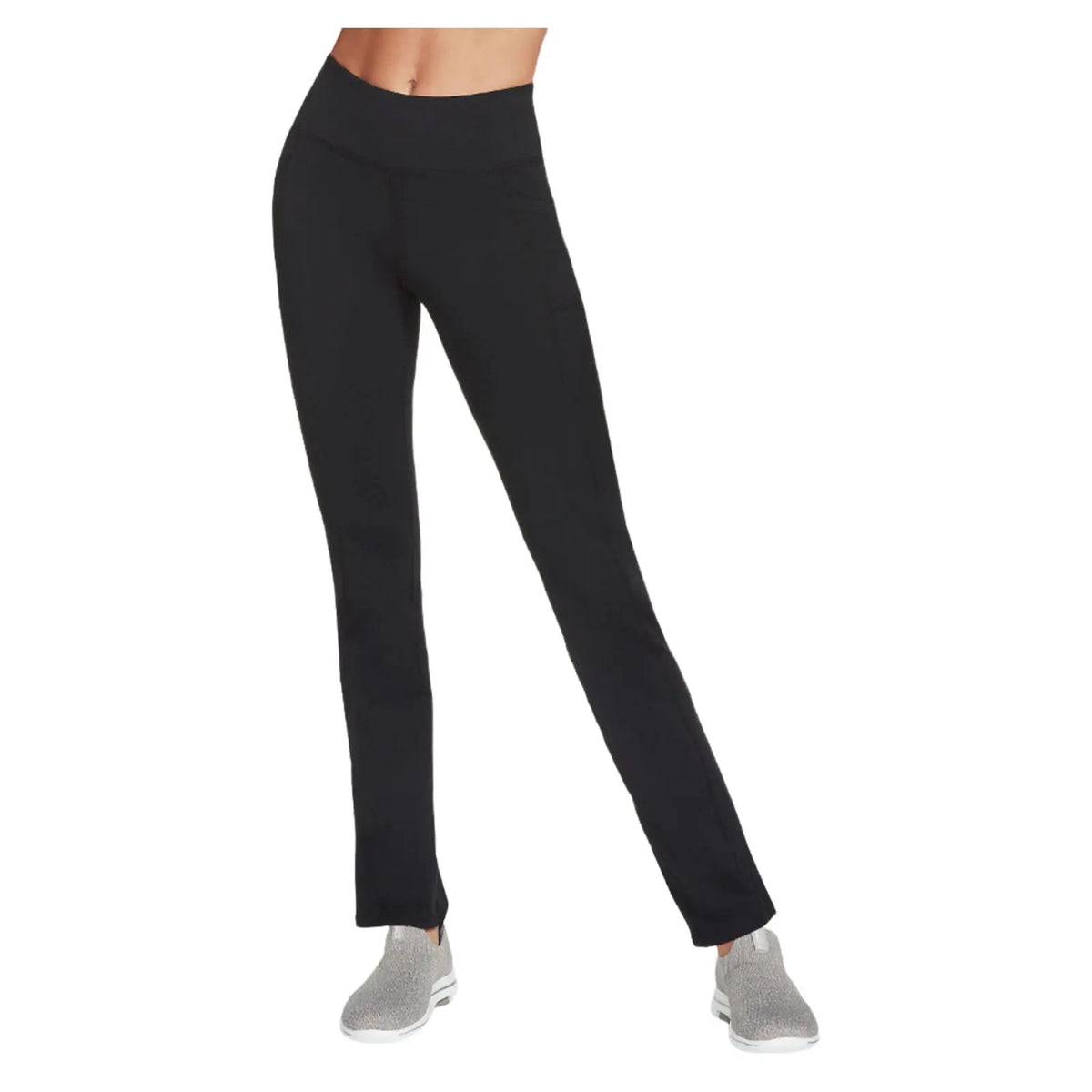 Black athletic pants are standing upright with a fitted high waist and minimalistic design. They are paired with gray footwear. The background is plain and white.