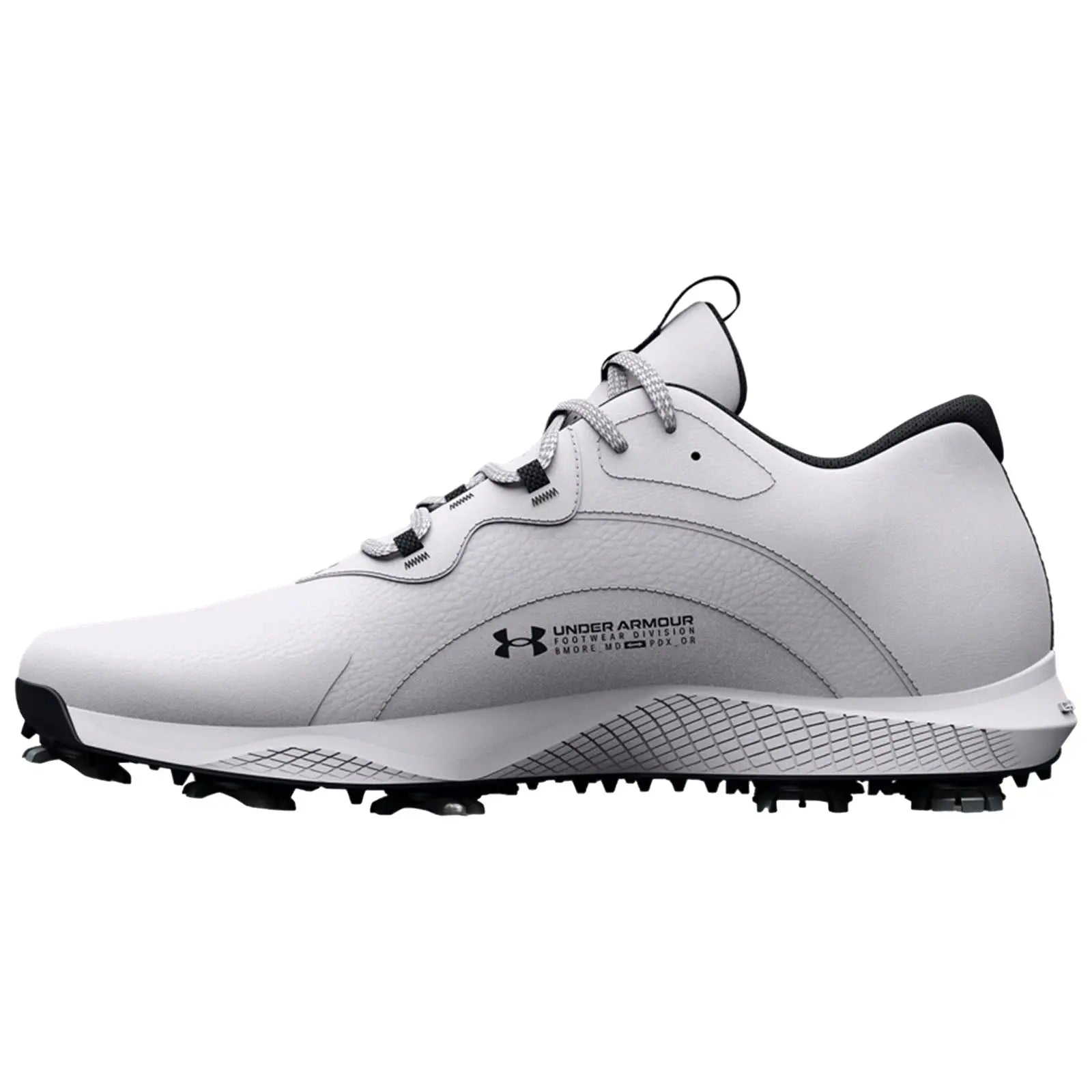 A white golf shoe with black accents is displayed on its side showcasing its design features and textured sole for grip on the course