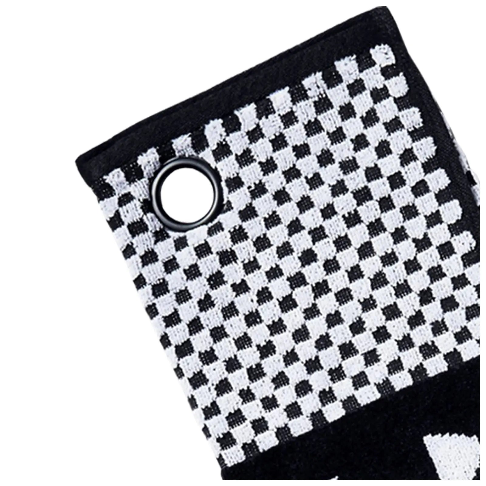 A black and white checkered fabric object is displayed with a circular metal eyelet at one corner suggesting it may be used for hanging or attachment in a textured pattern environment