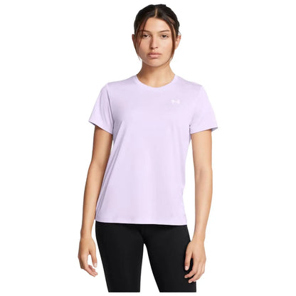 A young woman stands confidently wearing a light purple athletic t-shirt and black leggings, posing against a plain white background with a neutral expression.
