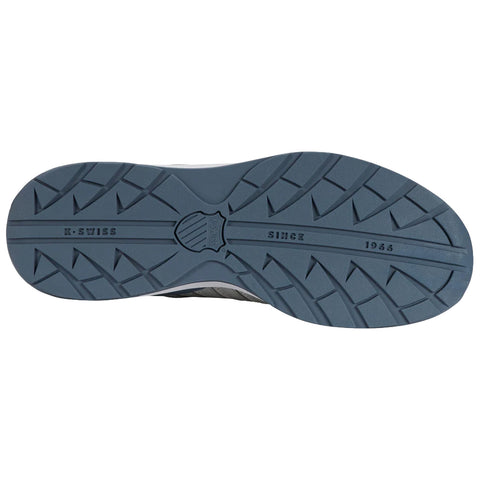 A gray and blue sneaker sole rests flat displaying a textured surface with treads designed for grip along with the text K-SWISS SINCE 1966 prominently featured in the center.