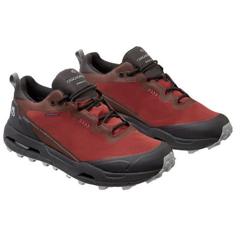 Red and brown hiking shoes are displayed prominently with a rugged design featuring a waterproof layer and textured soles suitable for outdoor activities in varied terrains.