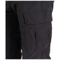 A pair of black cargo pants is displayed with visible pockets on the thigh area highlighting a textured fabric and stitching details in a clean and minimalist setting.